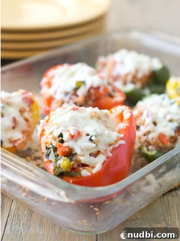 Colorful Turkey & Kale Quinoa Stuffed Peppers, baked and ready to eat.