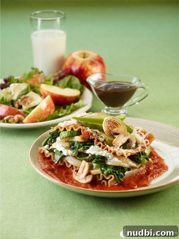 A delicious Slow Cooker Veggie Lasagna, rich with vegetables and cheese.