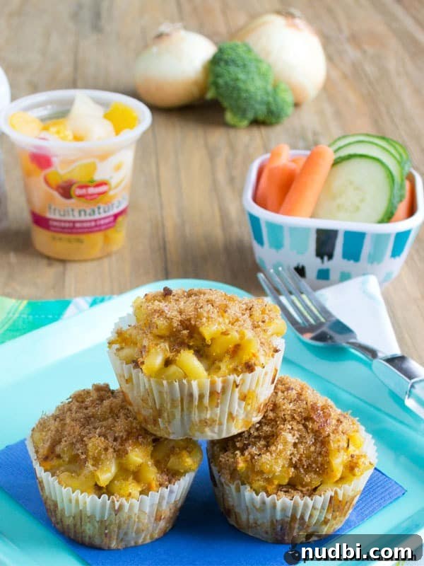 Individual Mac n Cheese Muffins, a kid-friendly way to enjoy mac and cheese with hidden veggies.