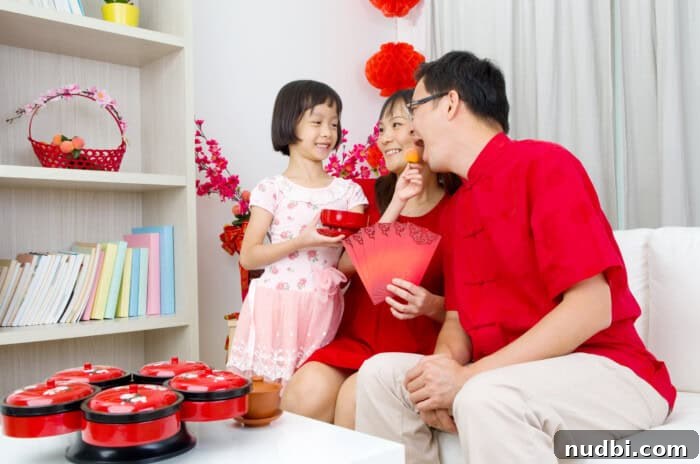 Joyful Asian families celebrating Chinese New Year with traditional decorations and festive activities.