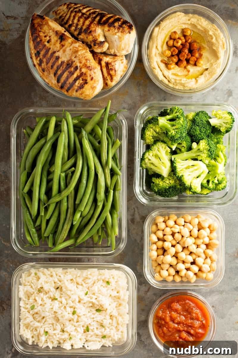 10 helpful Beginner’s Tips to Meal Planning Like a Pro A selection of meal prep containers filled with healthy, portioned meals, showcasing efficient cooking.
