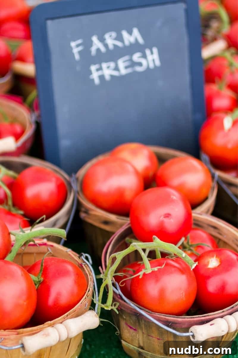 buying fresh produce for meal planning A basket overflowing with fresh, vibrant tomatoes, symbolizing healthy and seasonal produce for meal planning.