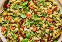 Pesto Chicken Pasta Salad with Sun-Dried Tomatoes and Basil