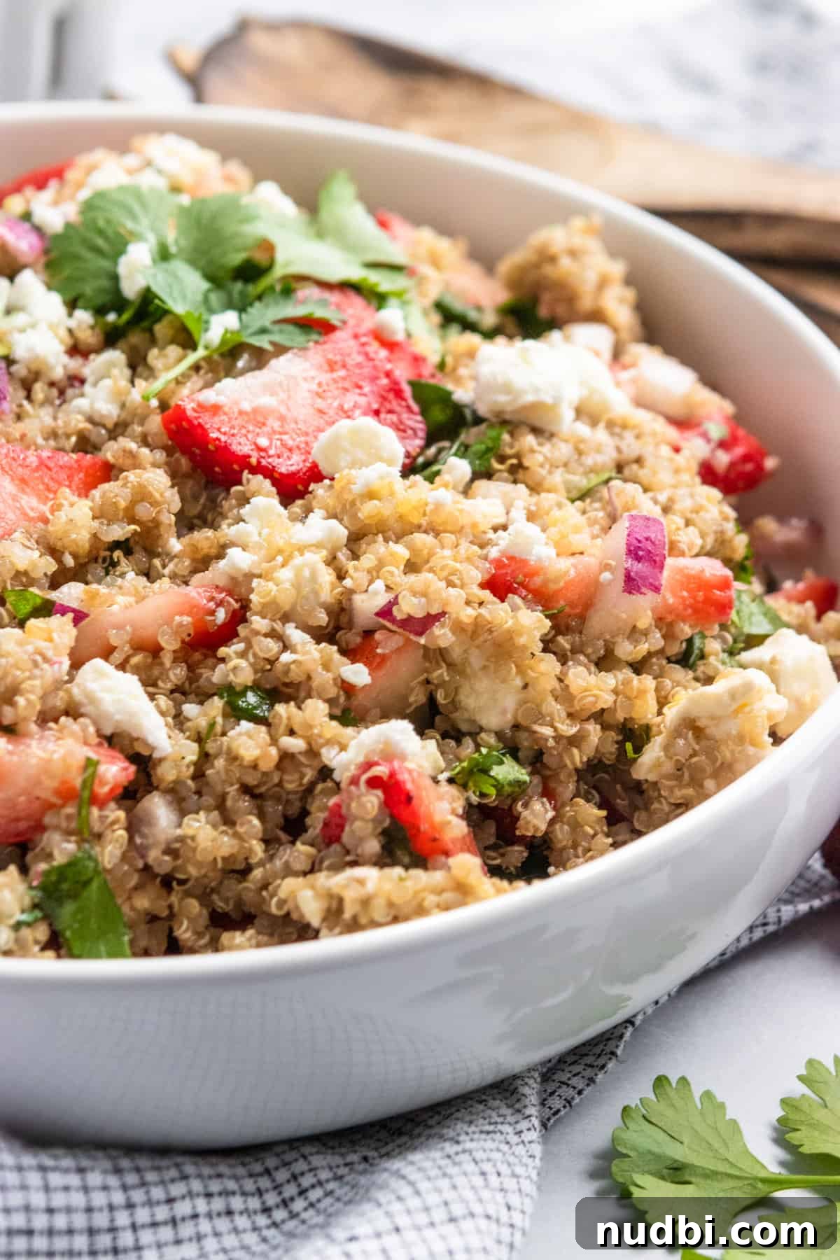 10 Refreshing Summer Salads and Sides for Your Next BBQ 4 Summer strawberry quinoa salad in white bowl.