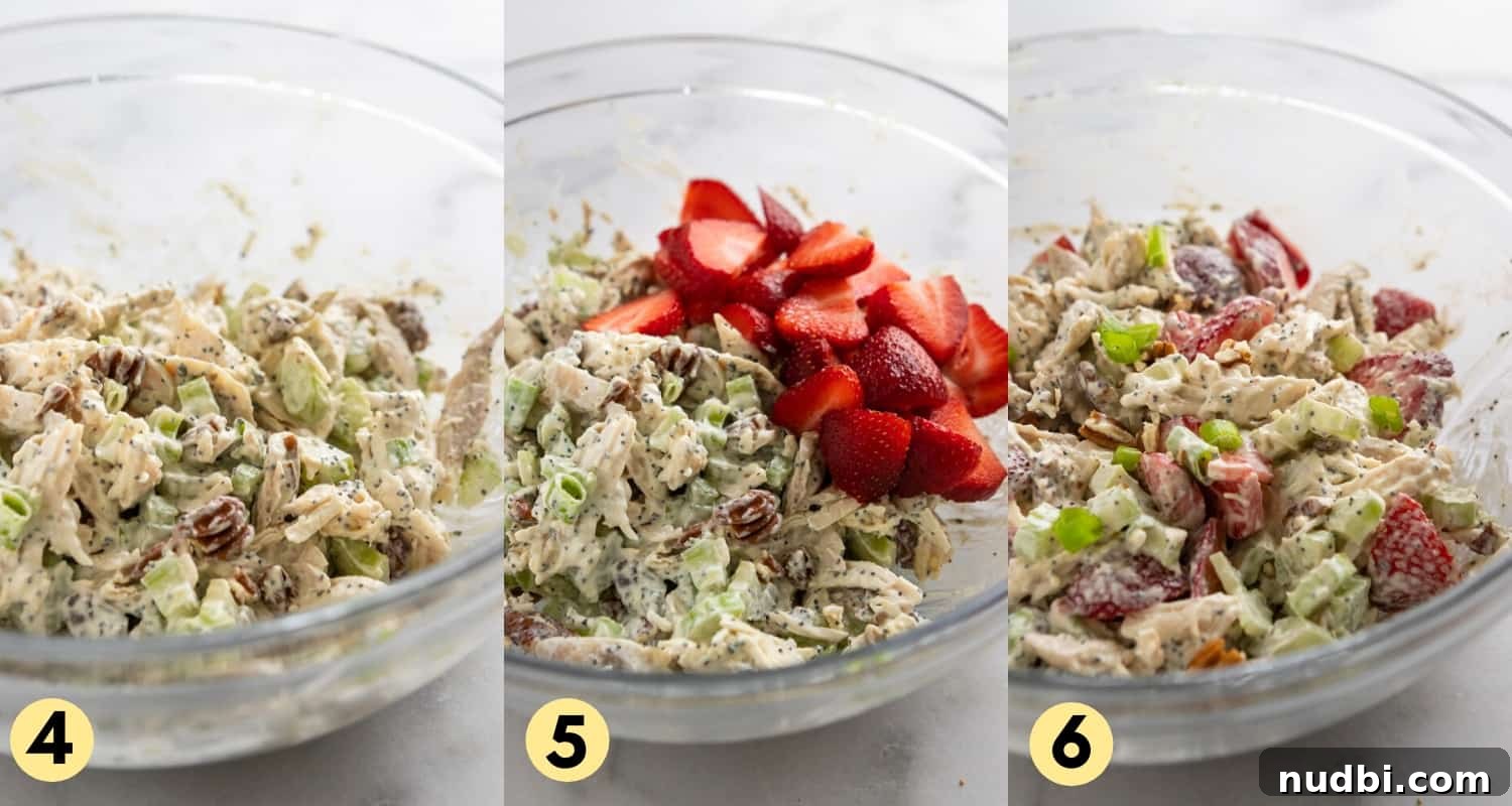 Strawberry Poppy Seed Chicken Salad with Pecans 6 Strawberries added to chicken salad in mixing bowl.