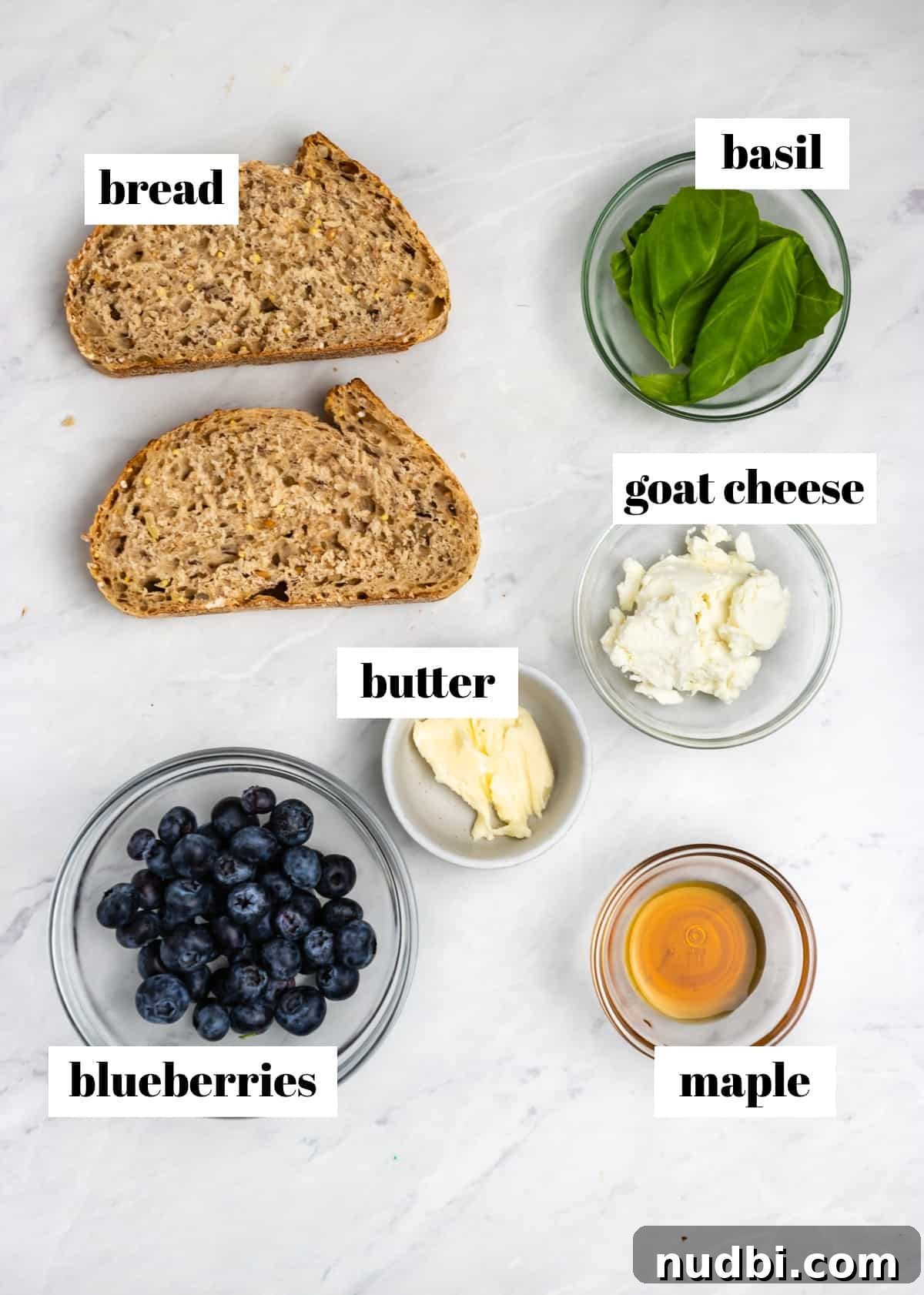 Blueberry, Basil & Goat Cheese Grilled Sandwich Recipe 3 Bread, cheese, basil, blueberries and other ingredients labeled on counter.