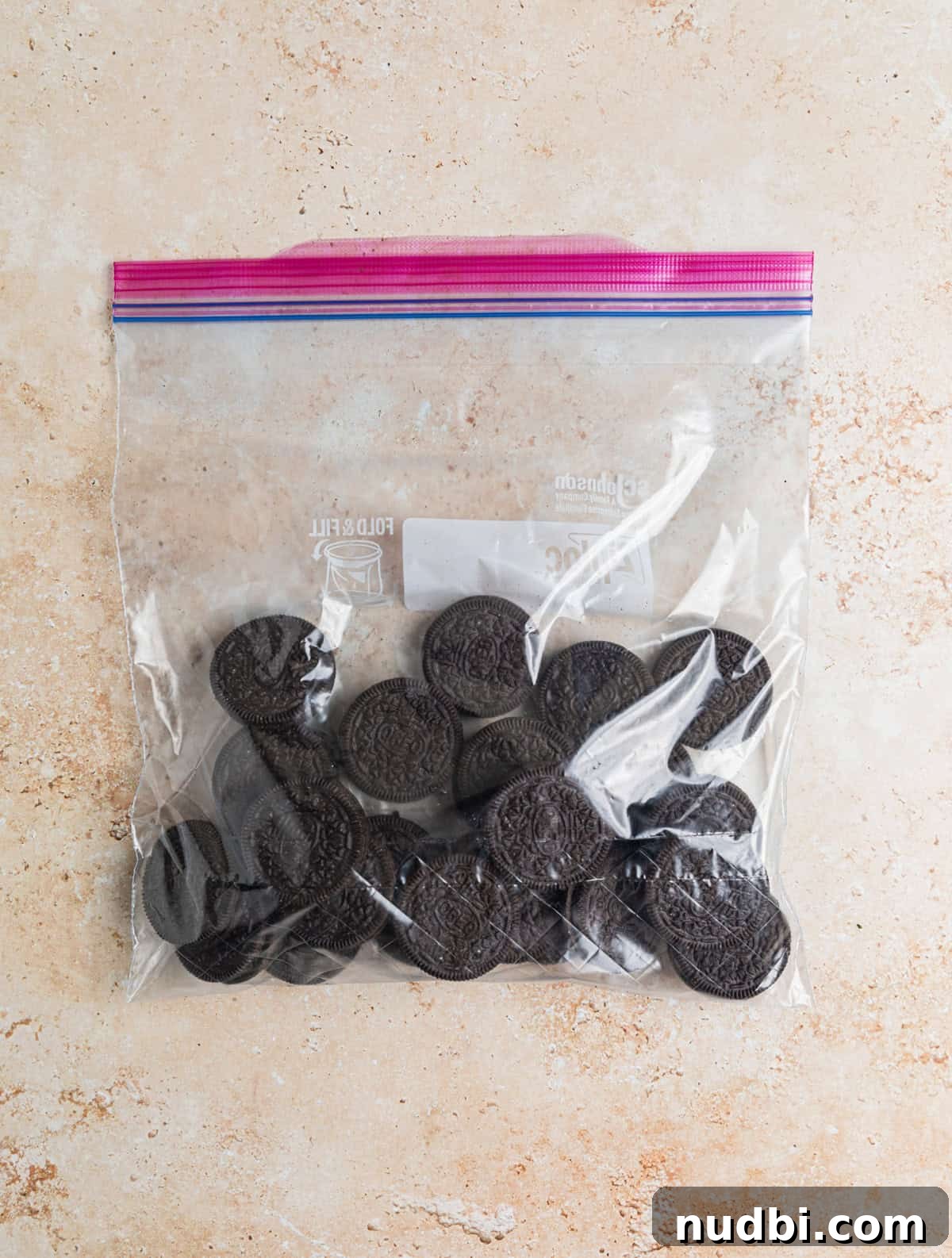 No-Bake Oreo Cheesecake Cups Recipe for Creamy Dessert 4 Oreo cookies in ziplock bag.