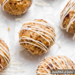 Coconut Mango Energy Bites: Tropical No-Bake Snack Recipe 7 Mango bites with white chocolate drizzle.