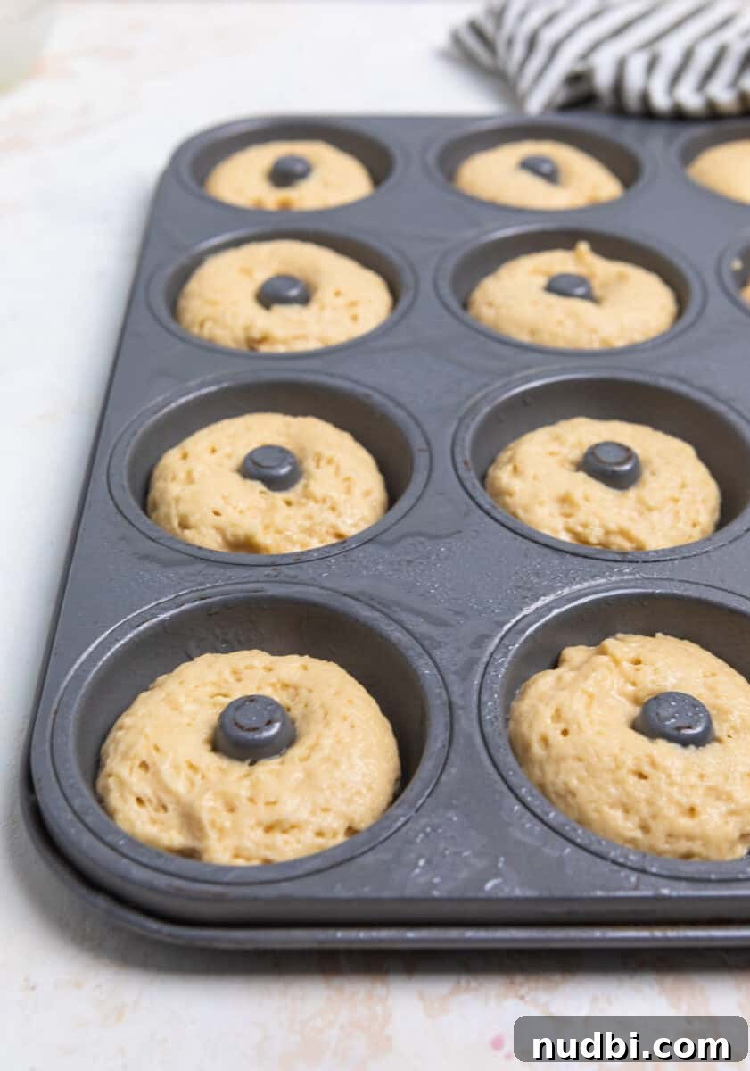 Triple Vanilla Donuts Recipe: Soft, Fluffy, and Extra Vanilla 5 Batter in donut pan.