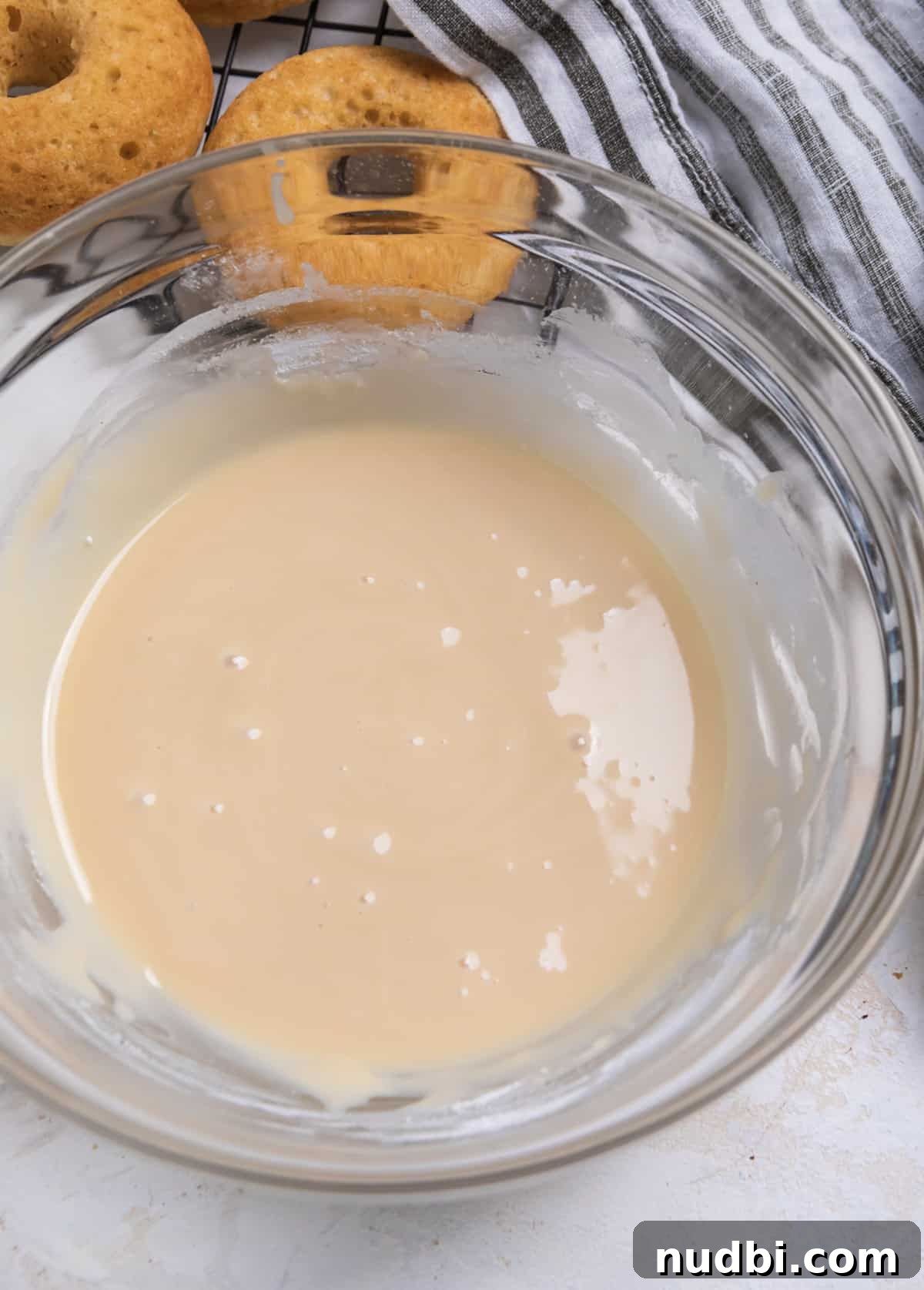 Triple Vanilla Donuts Recipe: Soft, Fluffy, and Extra Vanilla 7 Maple glaze in mixing bowl.