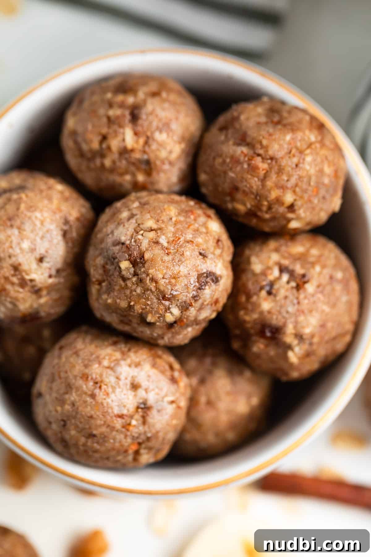 No-Bake Banana Bread Bites Recipe – Quick No-Oven Snack 2 No bake banana oat bites in bowl with gold trim.