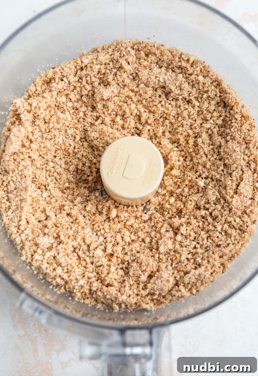 No-Bake Banana Bread Bites Recipe – Quick No-Oven Snack 5 Ground almonds, oats and walnuts in food processor.