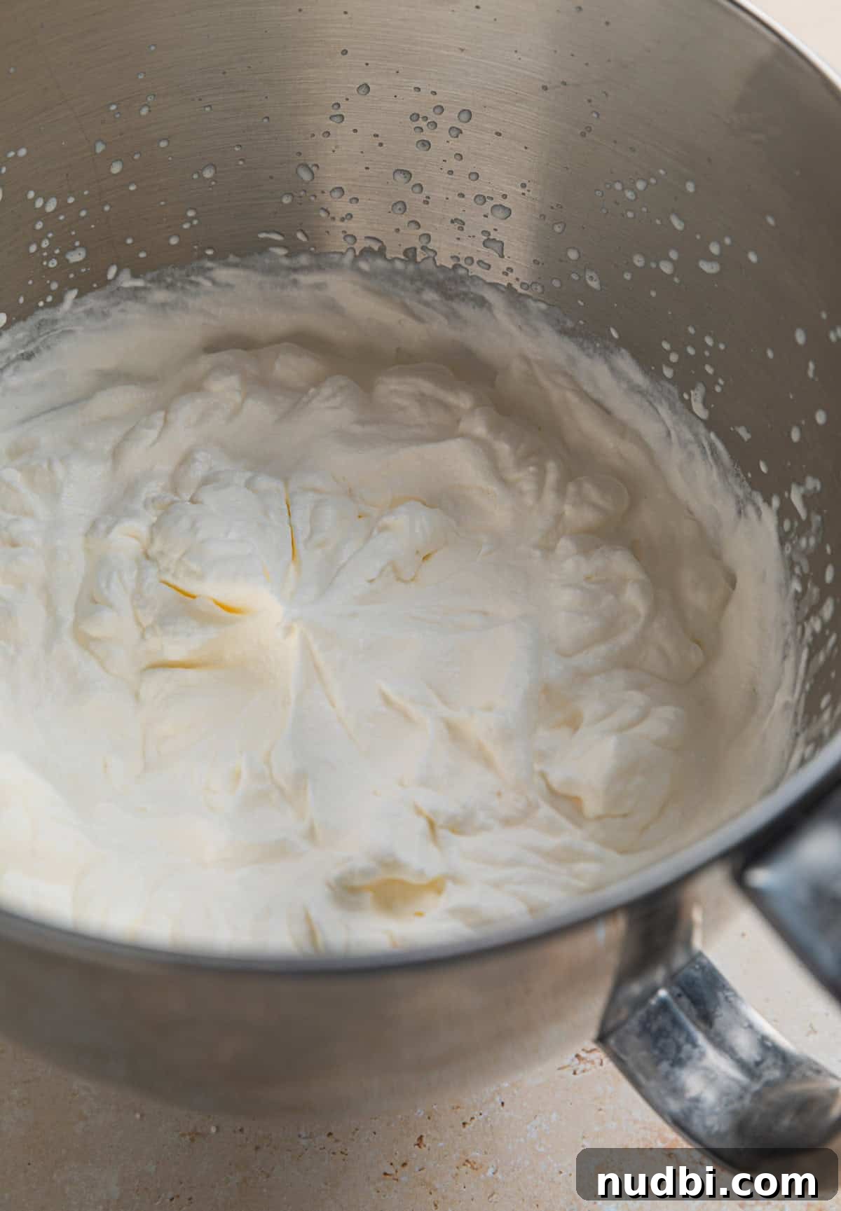 No-Churn Lemon Ice Cream Recipe — Creamy, Tart & Refreshing 5 Heavy whipping cream in electric mixer bowl whipped to stiff peaks.