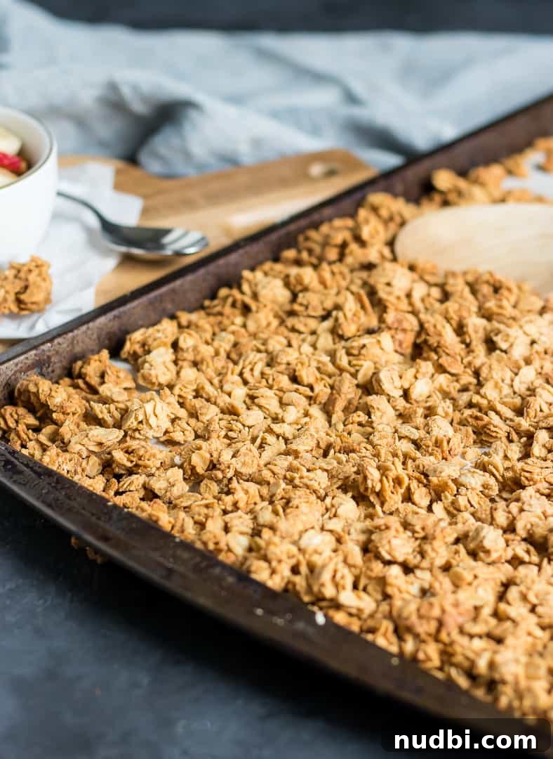 Crunchy Peanut Butter Granola Recipe for Homemade Mornings 5 Crunchy Peanut Butter granola on baking pan.