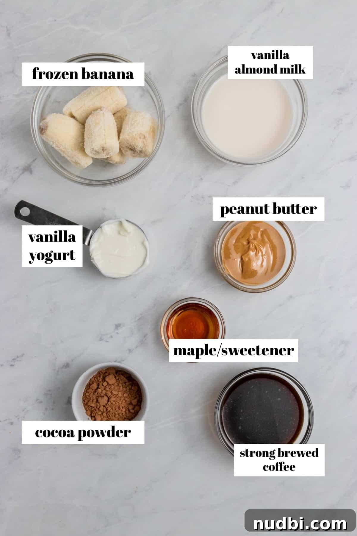 Peanut Butter Coffee Smoothie Recipe — Creamy Protein Boost 3 Banana, coffee, peanut butter and smoothie ingredients on counter.