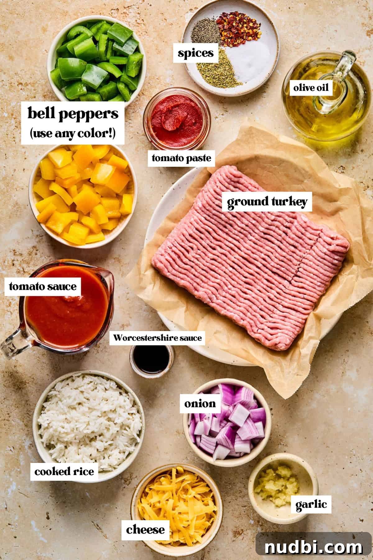 Weeknight Ground Turkey Skillet Dinner Recipe 3 Diced bell peppers, onions, raw ground meat, and other ingredients for recipe arranged on surface.