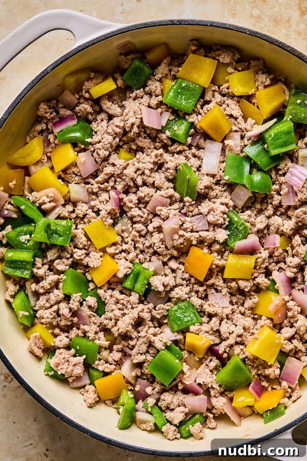Weeknight Ground Turkey Skillet Dinner Recipe 6 Browned ground turkey in skillet with peppers.