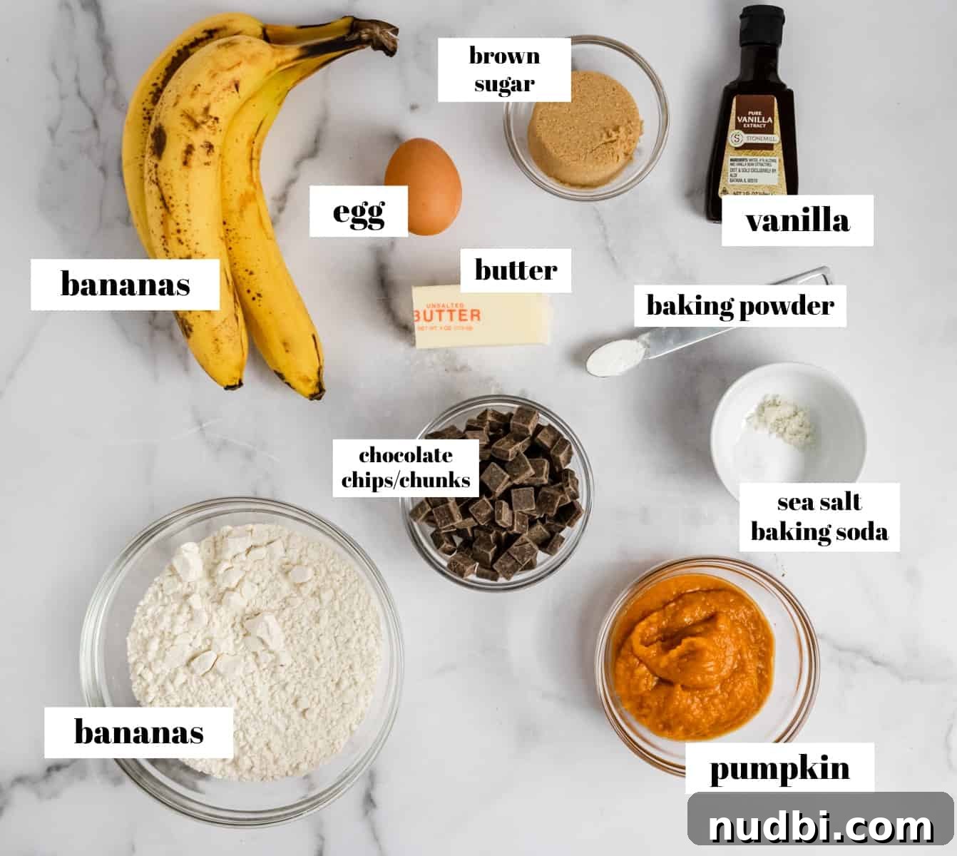 Pumpkin Chocolate Chip Banana Bread Recipe 4 Ingredients labeled on counter.