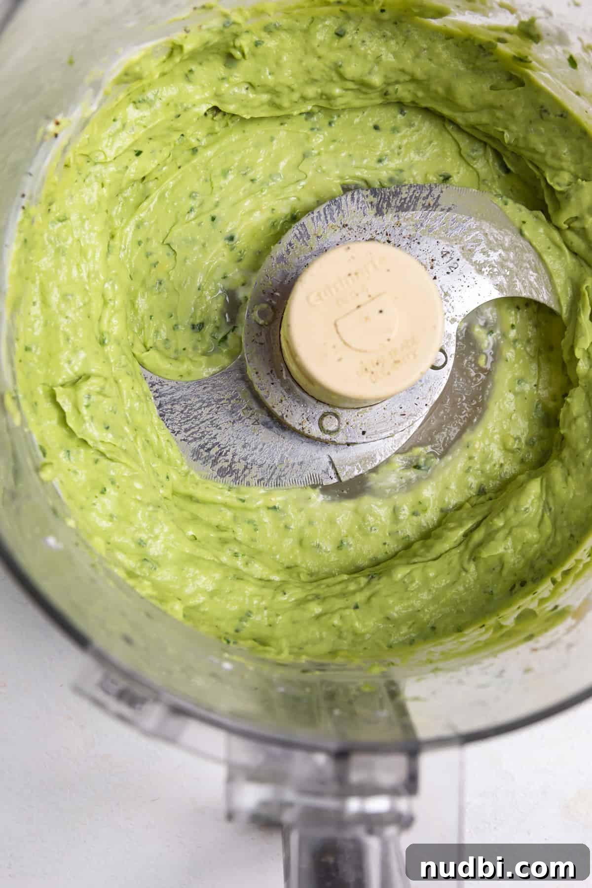 Sweet Potato Nachos with Creamy Avocado Sauce 3 Avocado crema in food processor.