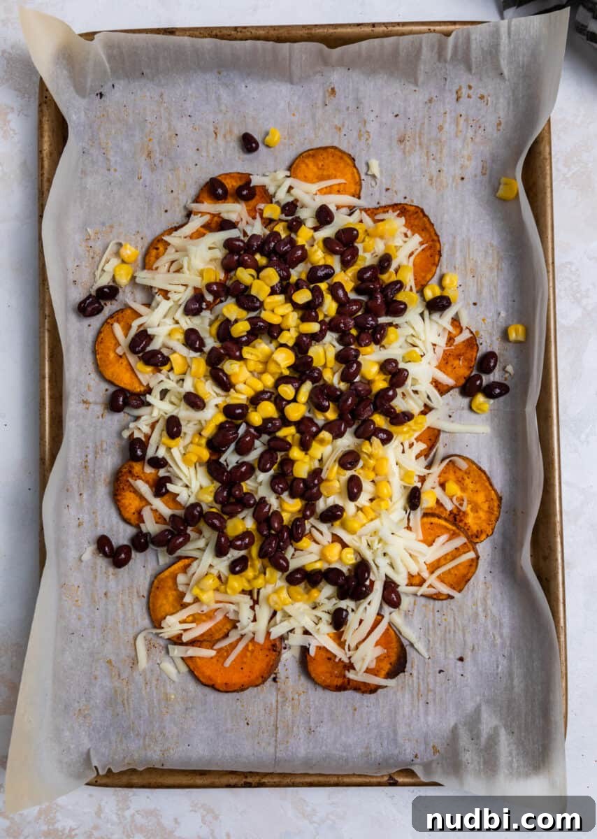 Sweet Potato Nachos with Creamy Avocado Sauce 6 Shredded cheese, corn and beans over top of roasted sweet potatoes.