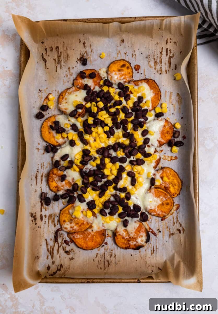 Sweet Potato Nachos with Creamy Avocado Sauce 7 Melted cheese and cooked beans and corn on roasted sweet potatoes.