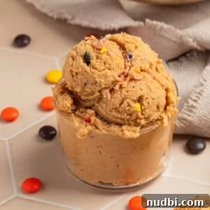 Edible Peanut Butter Cookie Dough Recipe for Safe Snacking 9 Glass with edible peanut butter cookie dough scooped into it.