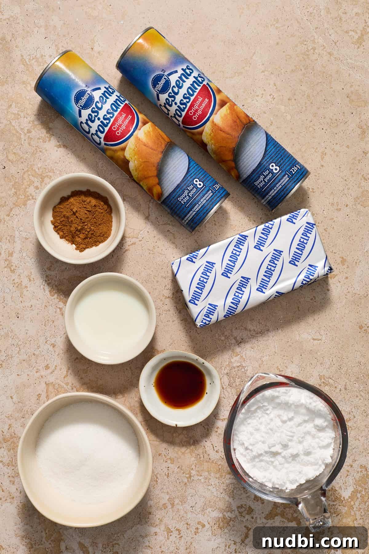 Cinnamon Crescent Roll Wreath Recipe — Festive Holiday Pastry 3 Ingredients on surface crescents, powdered sugar, cream cheese and more.