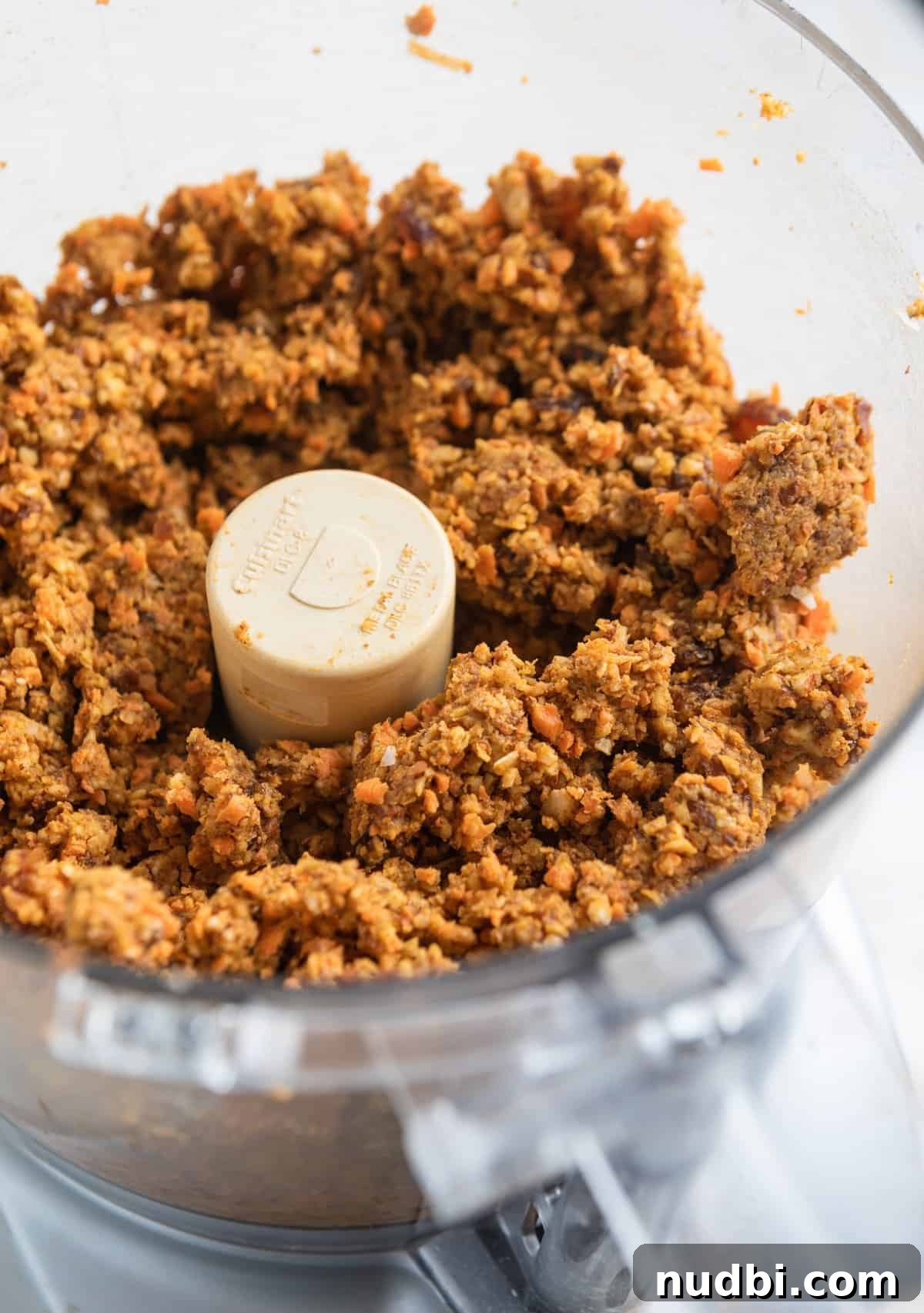 Carrot Cake Bites Recipe: Moist Mini Carrot Cake Balls 7 Carrot cake bite mixture in food processor.