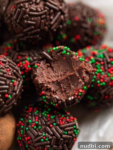 5 ingredient amaretto truffles on wax paper lined dish.