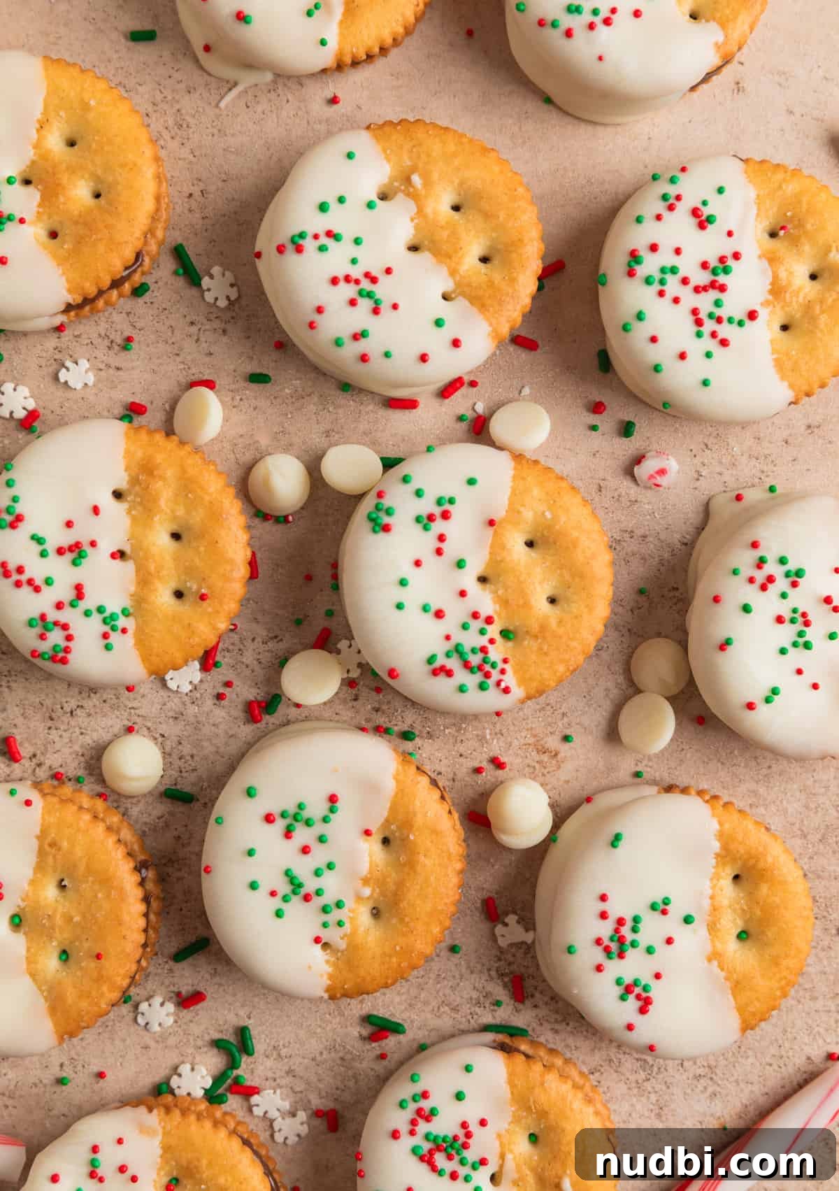 White Chocolate-Dipped Nutella Ritz Cracker Cookies 9 Christmas Ritz cracker cookies dipped in white chocolate and arranged on surface.