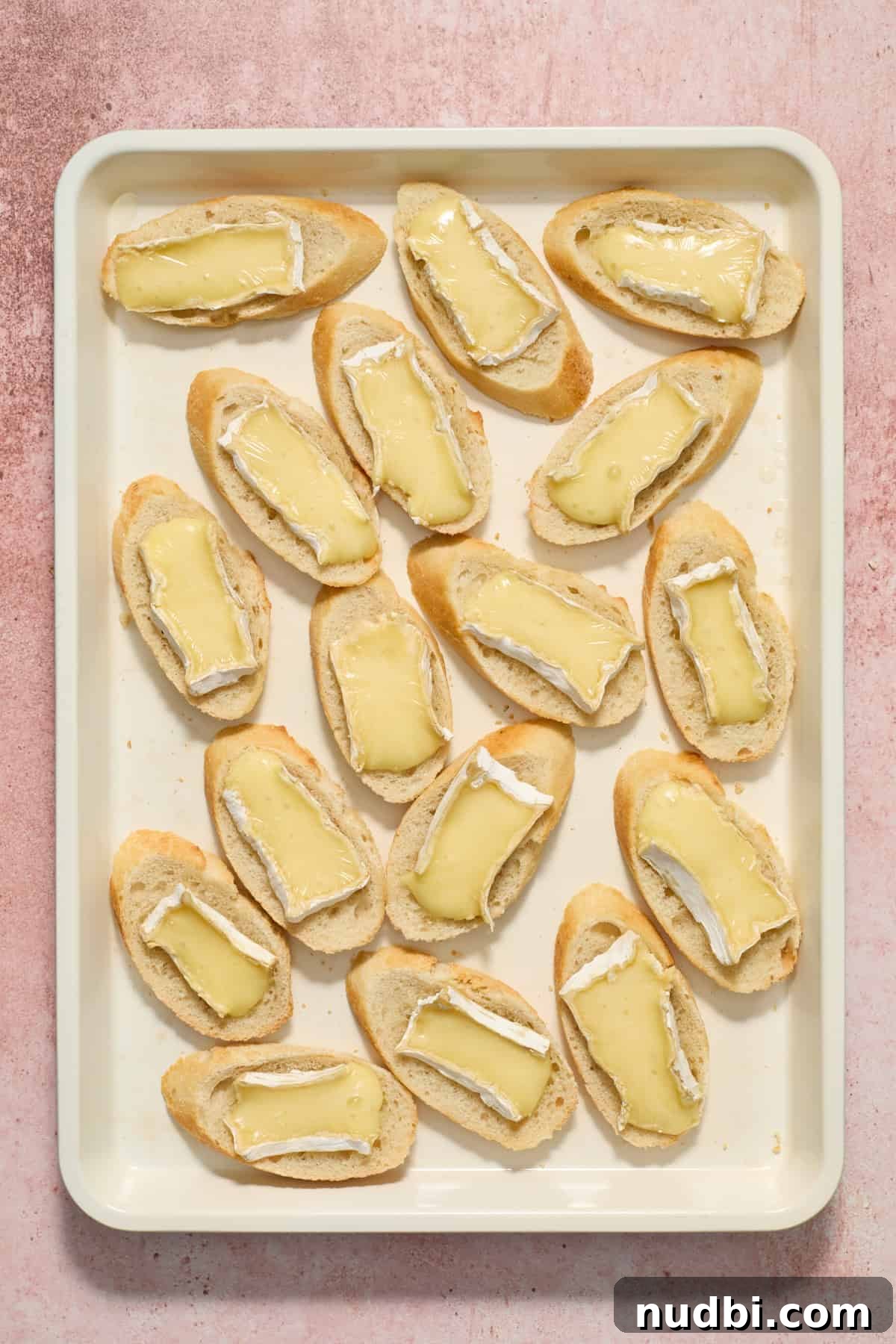 Cranberry Brie Crostini Recipe for Holiday Appetizers 7 Melted brie on small slices of baguette.
