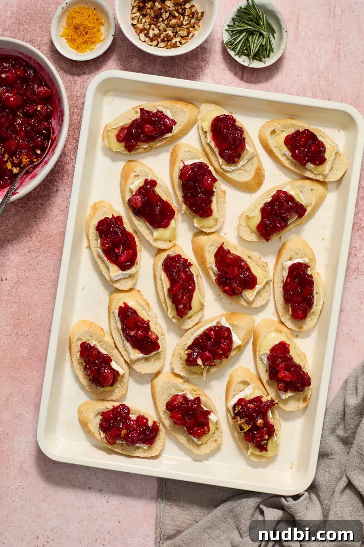 Cranberry Brie Crostini Recipe for Holiday Appetizers 8 Cranberry chutney spooned on top of brie crostini.