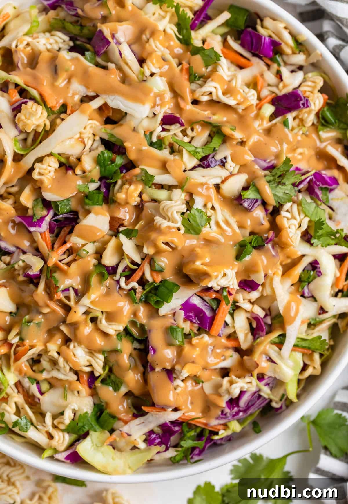 Crunchy Ramen Cabbage Salad with Creamy Peanut Dressing 2 Ramen cabbage salad with peanut dressing drizzled over top.