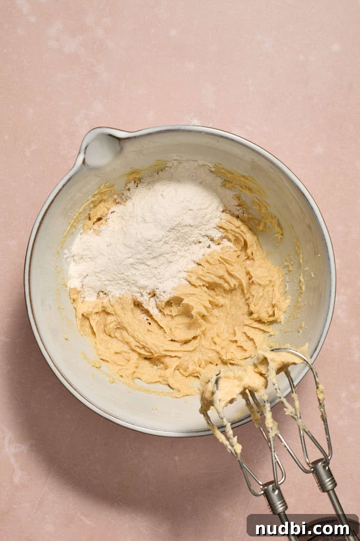 Peppermint Chocolate Chip Cookie Recipe: Festive Minty Cookies 9 Dry ingredients added to bowl with wet ingredients.