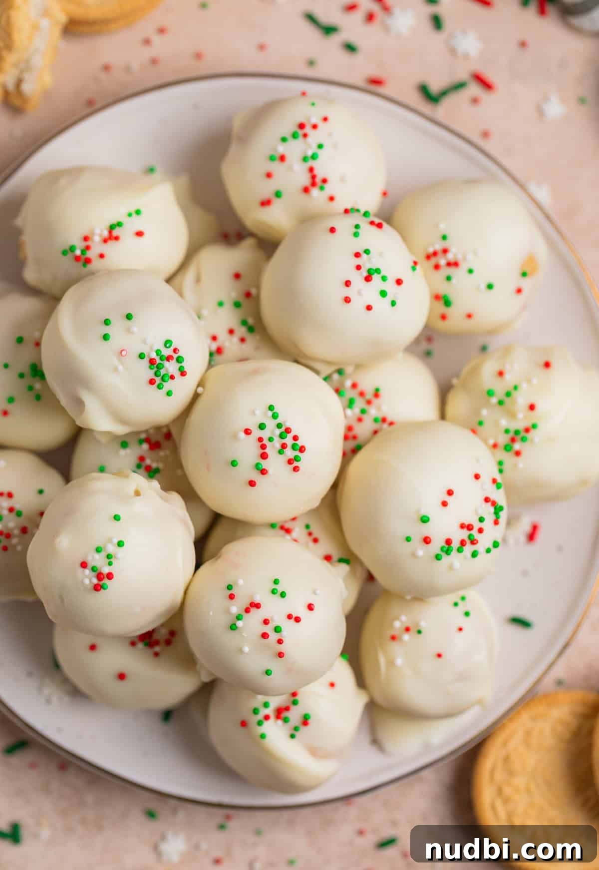 Festive Christmas Golden Oreo Truffles: Holiday Cookie Balls 6 Plate with Oreo balls topped with red, white and green holiday sprinkles on plate.