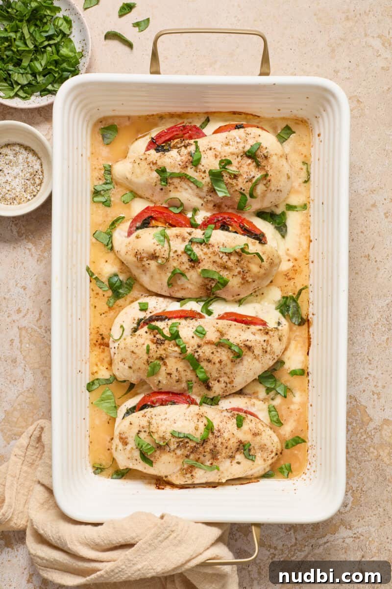 Mozzarella-Stuffed Chicken Breasts with Garlic Herb Pan Sauce 10 Cooked mozarrella stuffed chicken with chopped basil on top.
