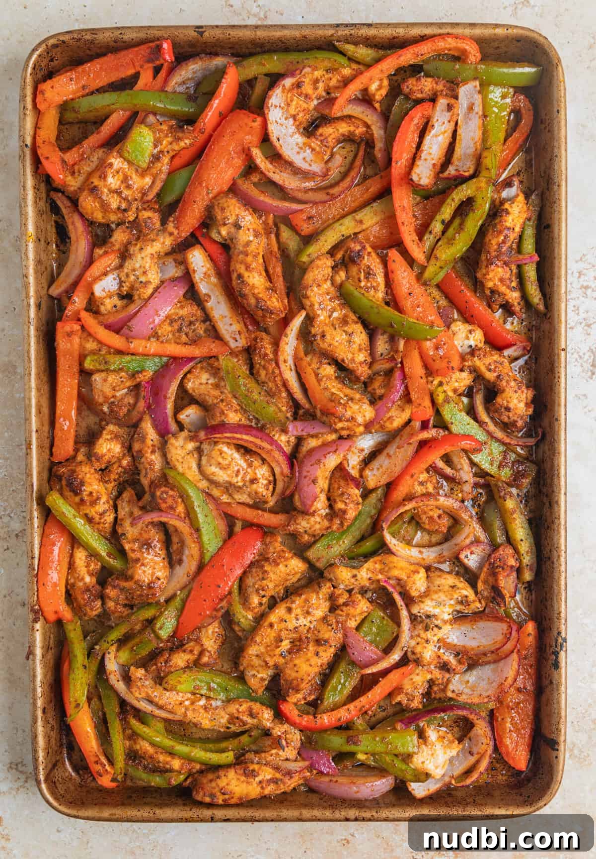 Honey-Lime Baked Chicken Fajitas Recipe for Flavorful Weeknights 8 Baked chicken fajitas on sheet pan.