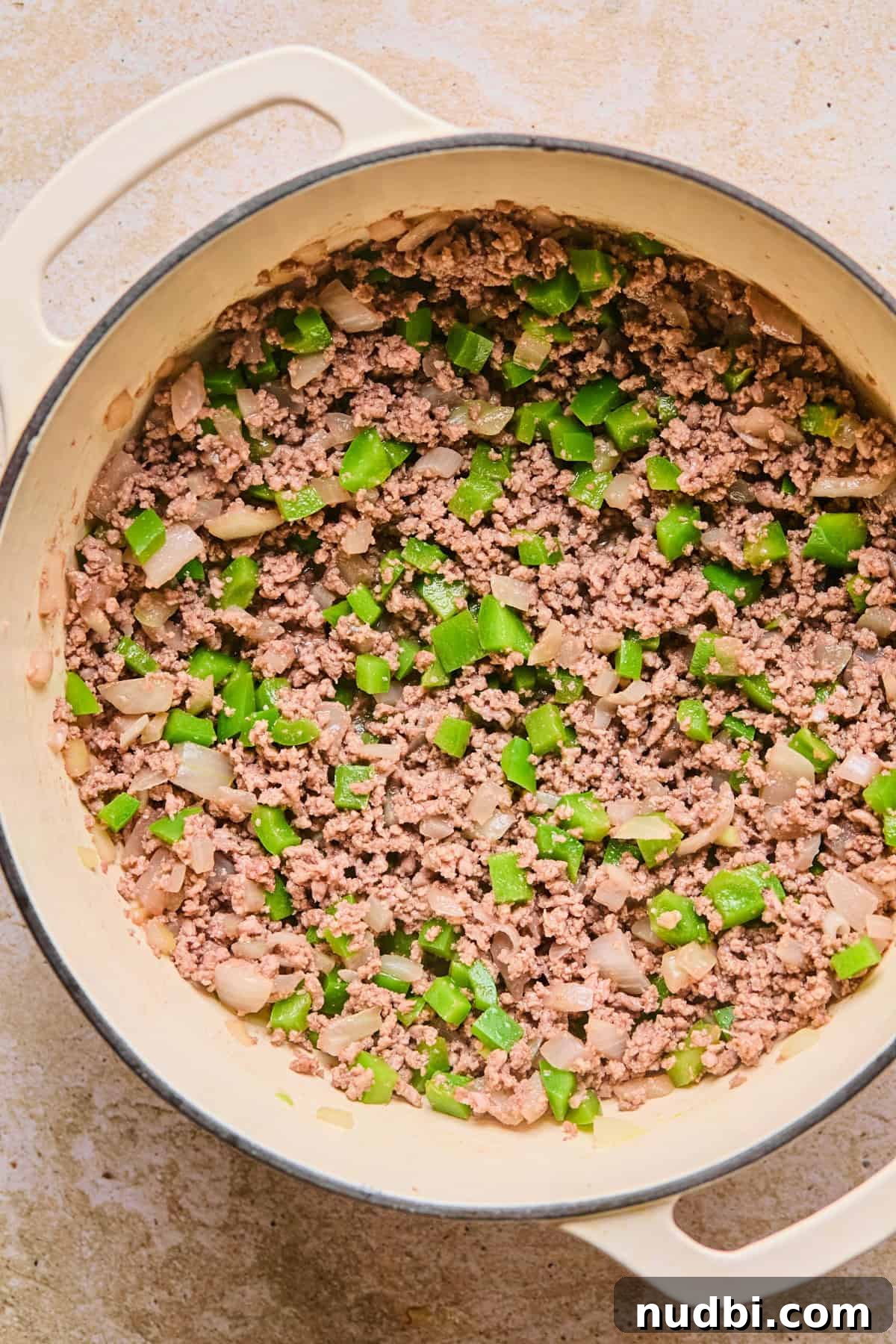 One-Pot Chili Mac: Cheesy Beef Skillet Dinner 7 Browned meat and veggies in stock pot.
