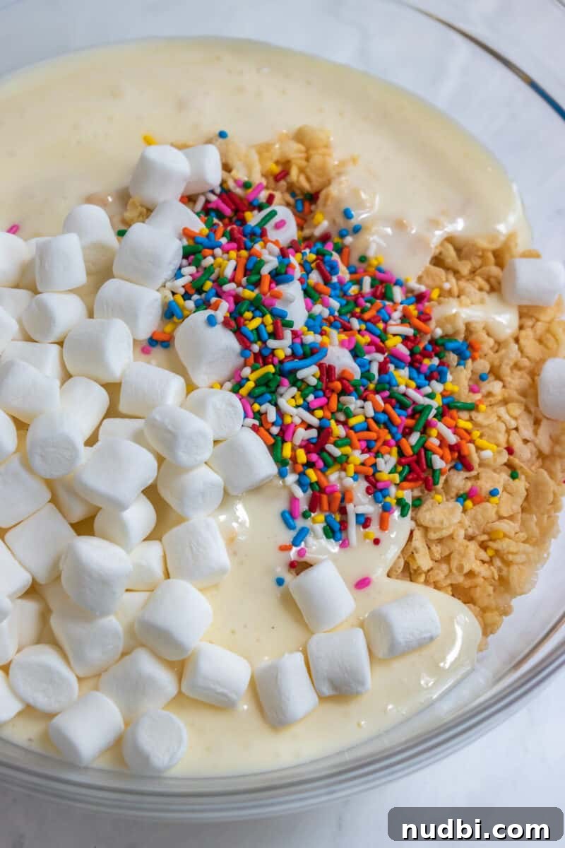 Funfetti Rice Krispie Treats Recipe for Colorful Party Snacks 4 Marshmallows, sprinkles, rice krispies in mixing bowl.