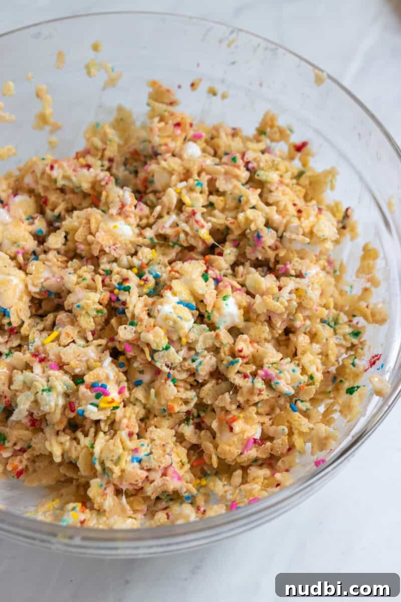 Funfetti Rice Krispie Treats Recipe for Colorful Party Snacks 5 Mixing bowl with funfetti rice krispie treat mixture.