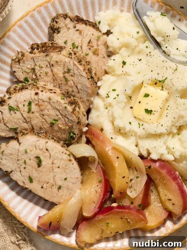 Crispy Instant Pot Carnitas Recipe for Tender, Crunchy Pork 12 Pork tenderloin sliced on plate with apples and mashed potatoes.