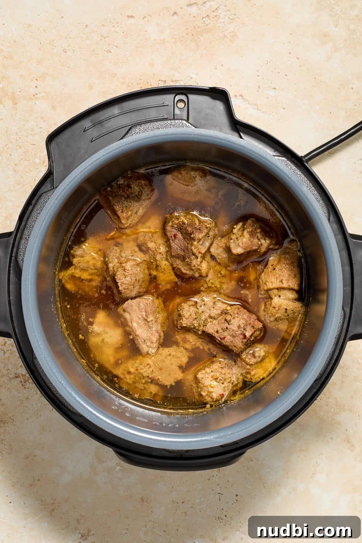 Crispy Instant Pot Carnitas Recipe for Tender, Crunchy Pork 6 Cooked pork carnitas in pot before shredding.