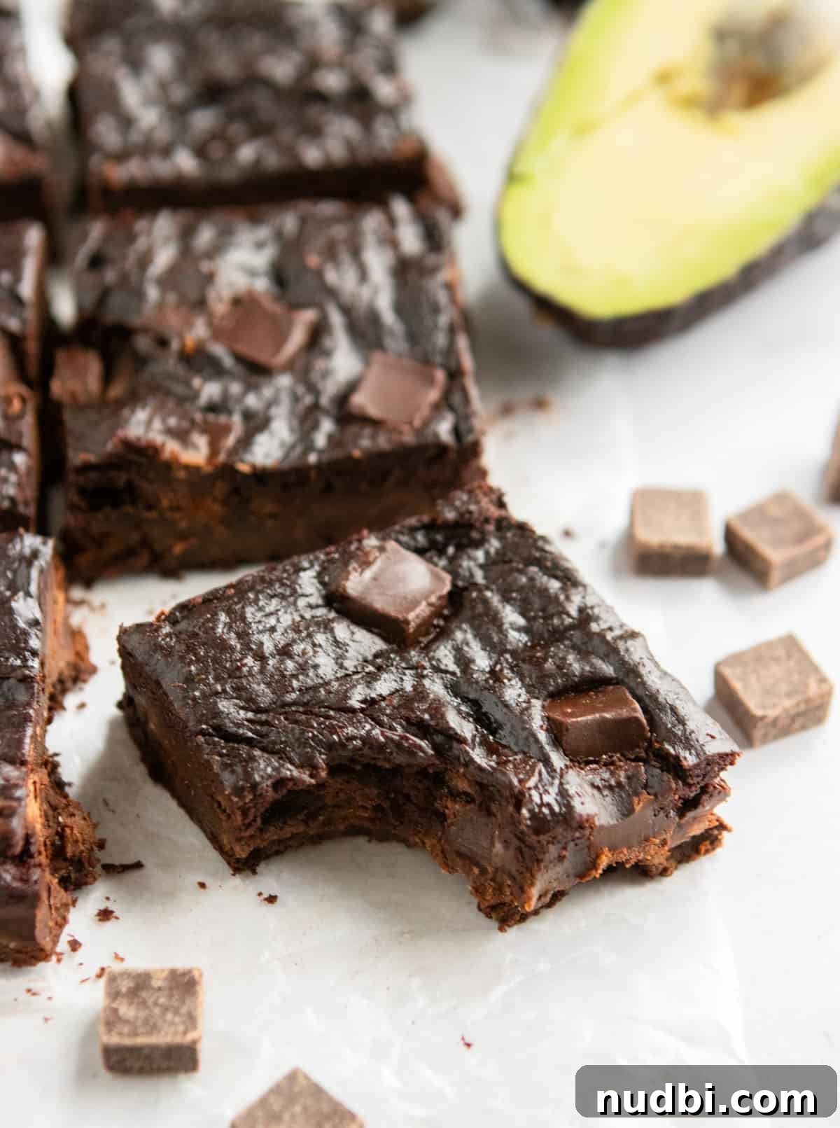 Fudgy Avocado Chocolate Chunk Brownies That Melt in Your Mouth 2 Avocado brownies with bite taken.