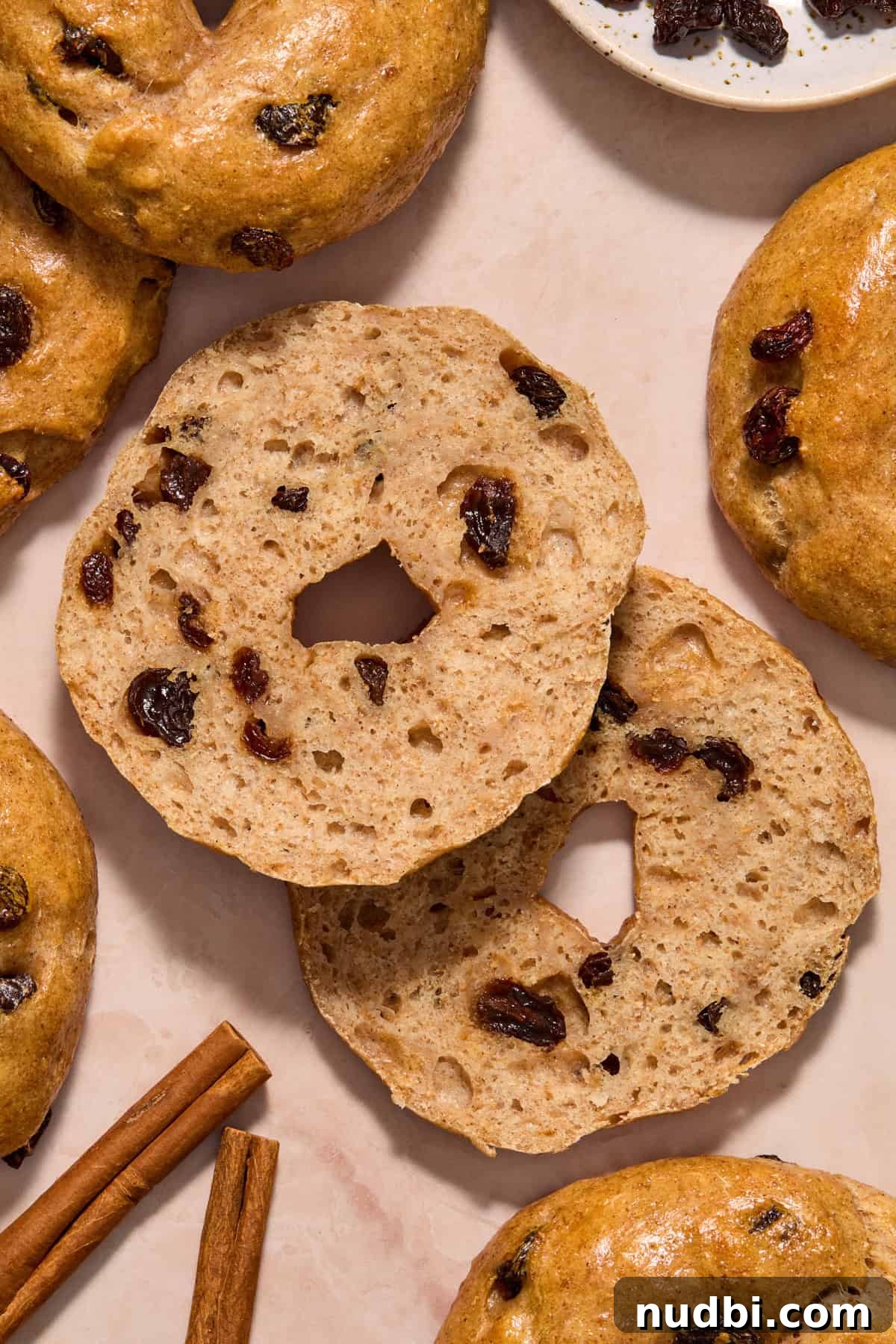 Cinnamon Raisin Bagel Recipe: Homemade Soft Chewy Bagels 12 Sliced bagel to show texture on the inside of the bagel.