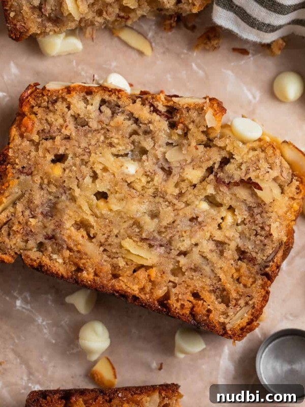 Cinnamon Raisin Bagel Recipe: Homemade Soft Chewy Bagels 14 Banana bread slice with white chocolate chips and other slices surrounding.