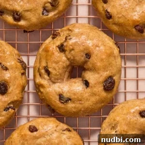 Cinnamon Raisin Bagel Recipe: Homemade Soft Chewy Bagels 17 Cinnamon raisin greek yogurt bagels on cooling rack.