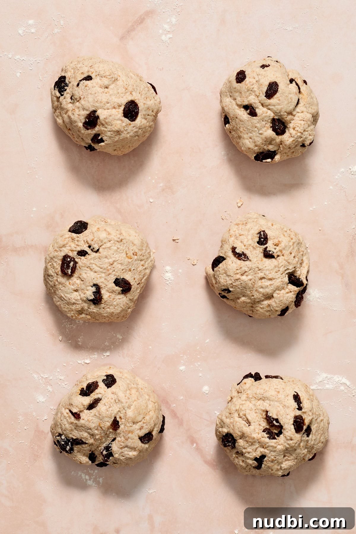 Cinnamon Raisin Bagel Recipe: Homemade Soft Chewy Bagels 9 6 even balls of bagel dough arranged on surface.