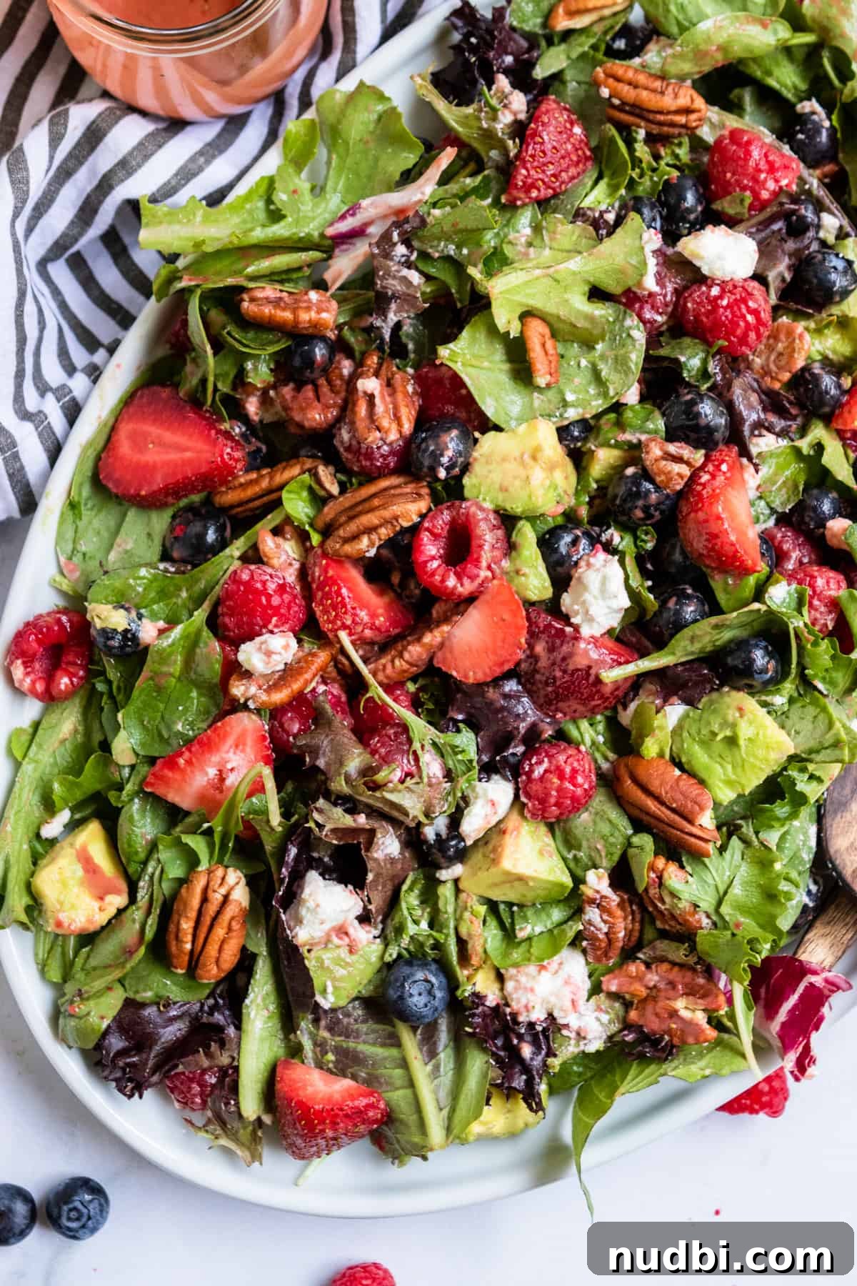Mixed Greens with Berries and Strawberry Balsamic Dressing 7 Overhead view of mixed green salad with berries.