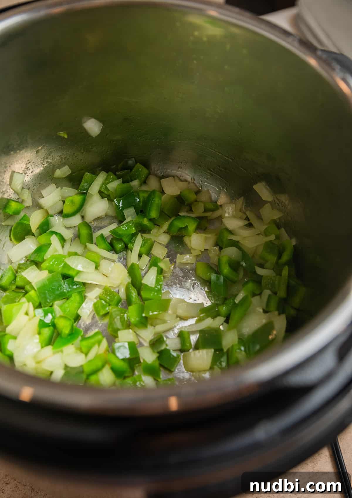 Instant Pot Chicken Tortilla Soup Recipe 4 Green bell pepper and onions sautéed in Instant Pot.