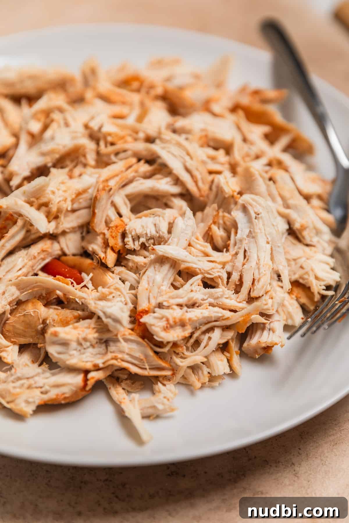 Instant Pot Chicken Tortilla Soup Recipe 8 Shredded chicken on plate with forks.
